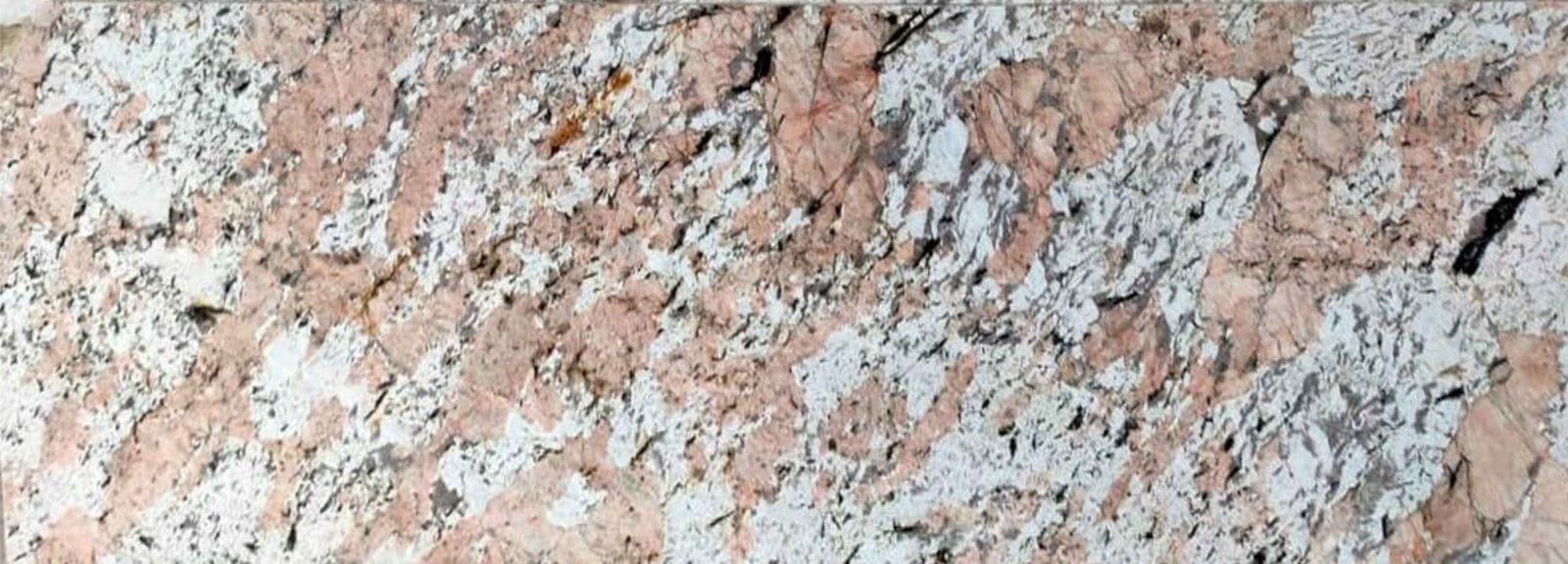 Alaska Pink Granite slab &mdash; pale rose-pink to blush with grey mineral speckles