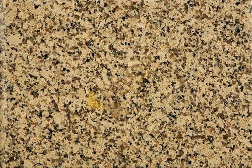 Crystal Yellow Granite slab &mdash; warm golden-yellow with crystalline sparkle and cream quartz inclusions