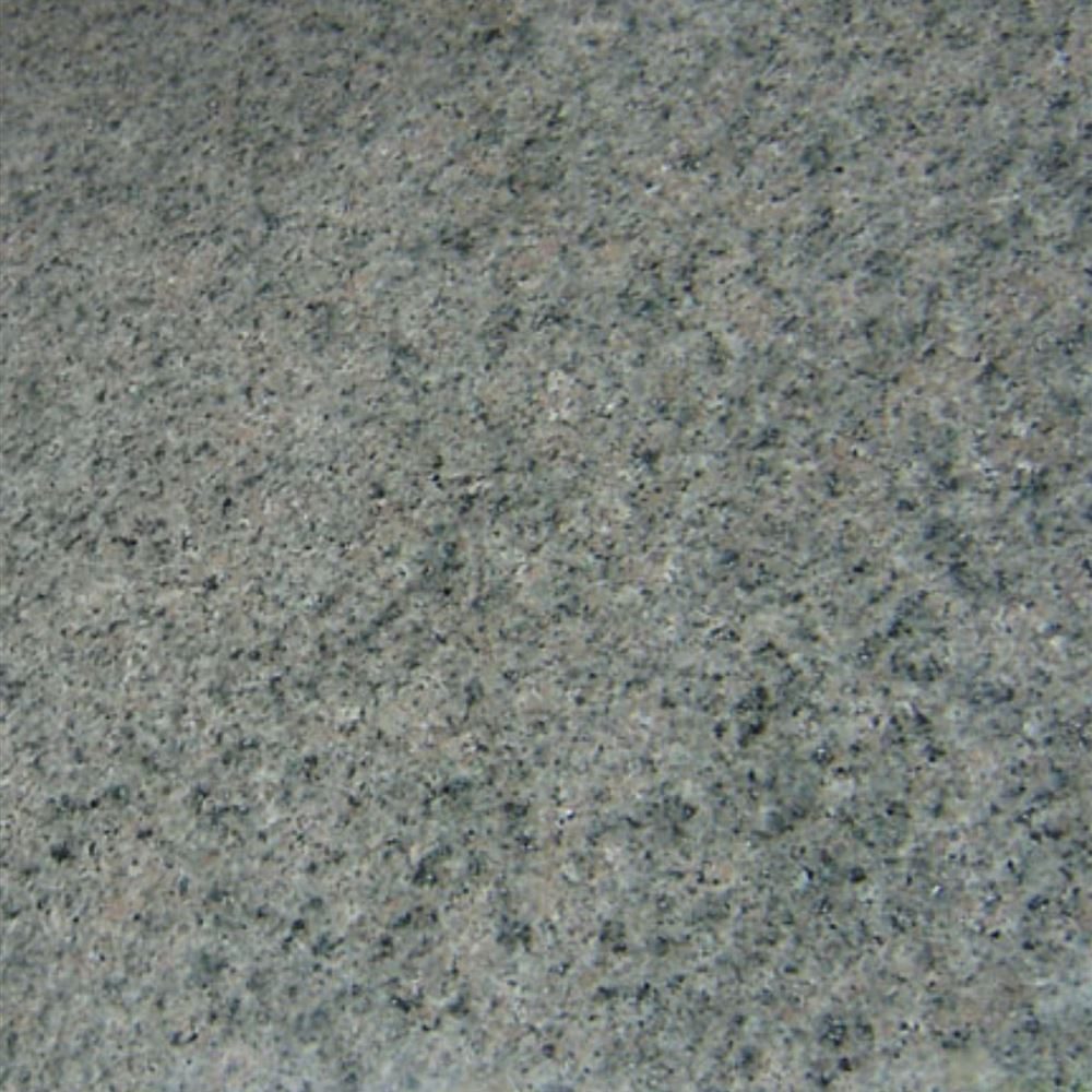 French Green Granite slab &mdash; rich forest-green to dark emerald with black and cream mineral inclusions