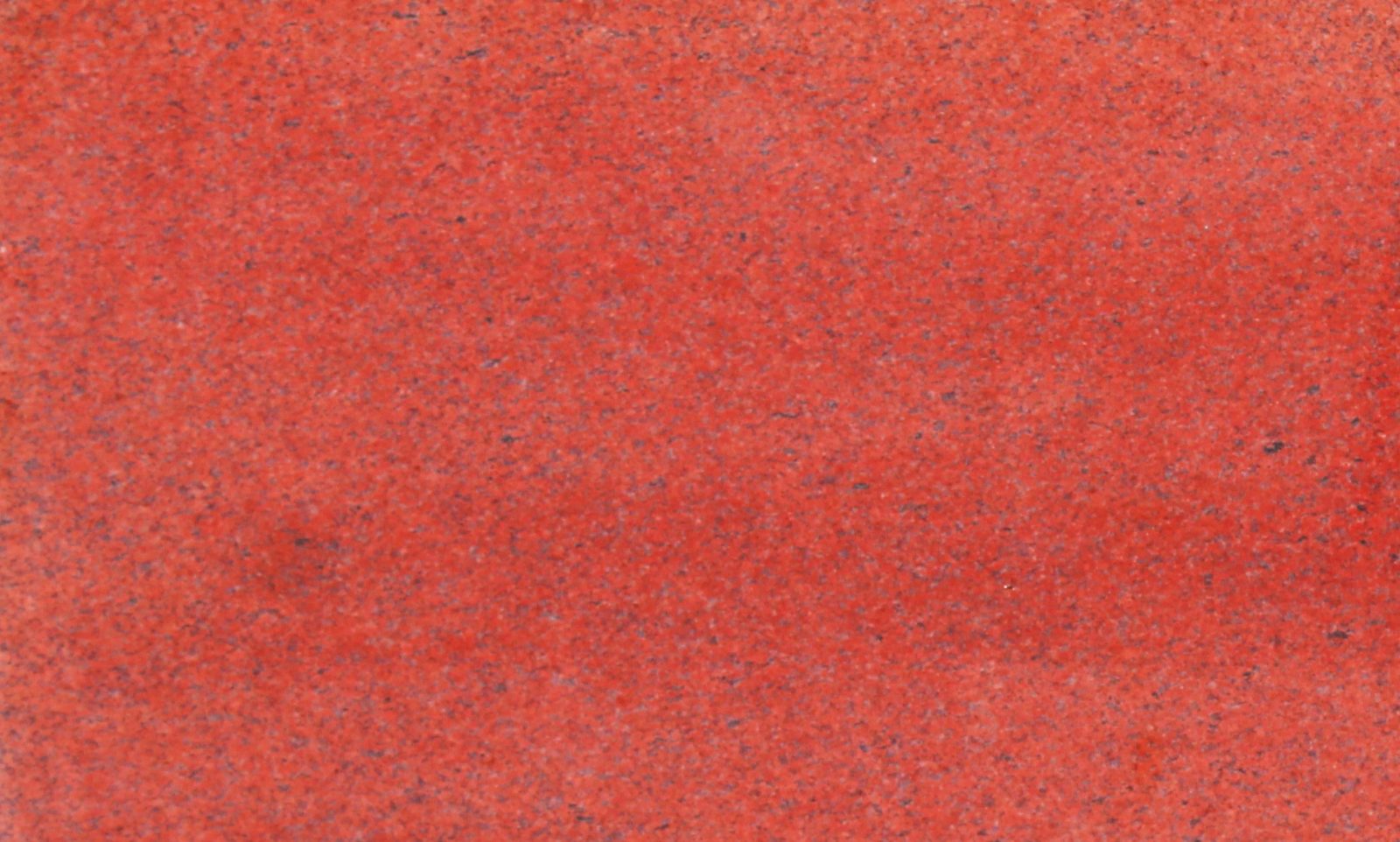 Lakha Red Granite slab &mdash; deep crimson-red to dark red with cream quartz and biotite inclusions