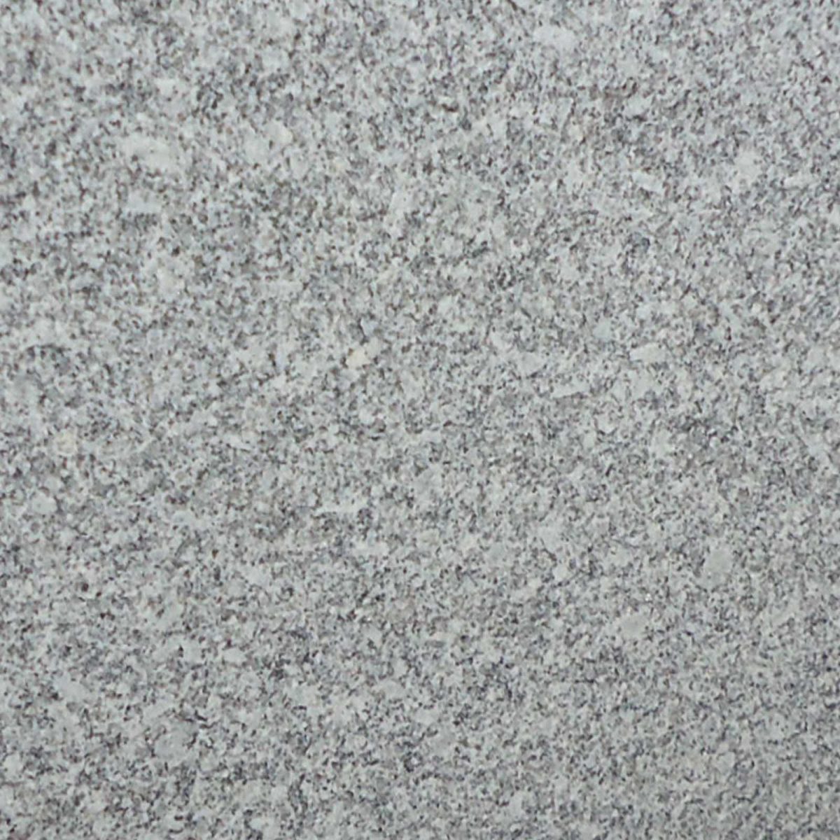 S White Granite slab &mdash; clean white with fine uniform grey and black speckles