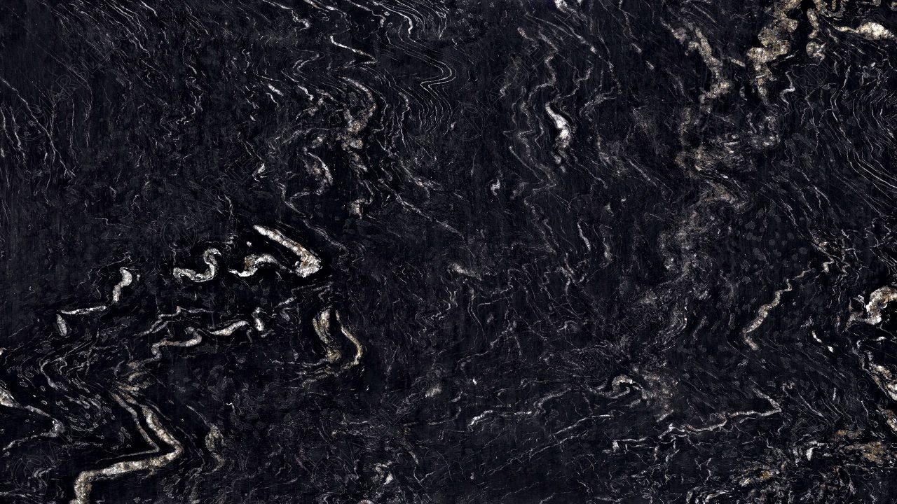 Titanium Black Granite slab &mdash; deep charcoal-black with silver-grey titanium crystal inclusions